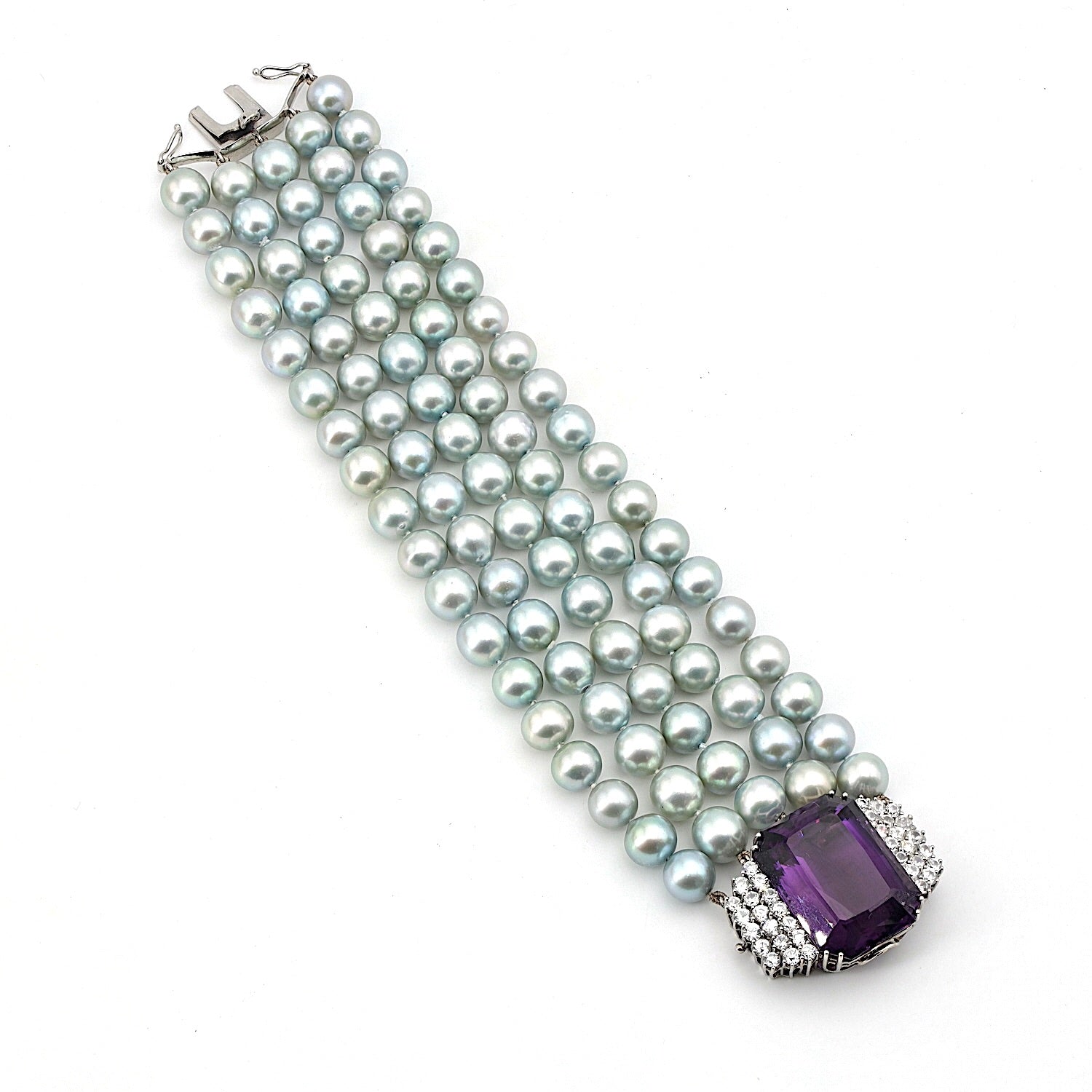 Bracelet with 5 rows of cultured pearls and a lock in 750 white gold with brilliants and an amethyst, horizontal top view