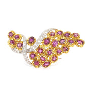 Bicolor 750 gold brooch with rubies and diamonds, standing frontal
