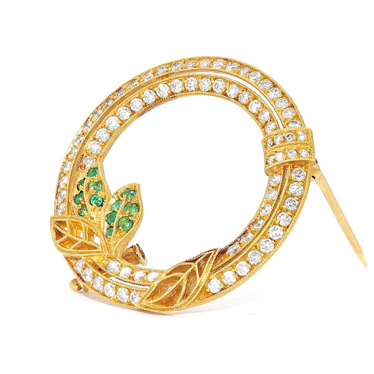 Brooch in 750 yellow gold with brilliants and emeralds, standing inks turned