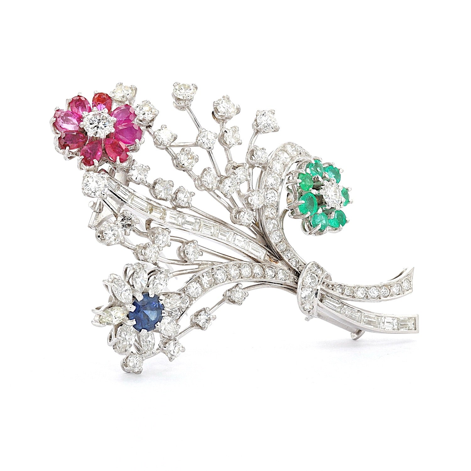 Brooch in platinum with diamonds, brilliants, rubies, sapphires and emeralds, standing turned to the right