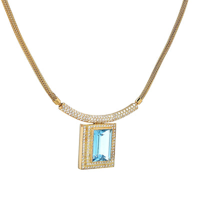 Necklace in 750 yellow gold with a blue precious topaz and brilliants, hanging, twisted to the right