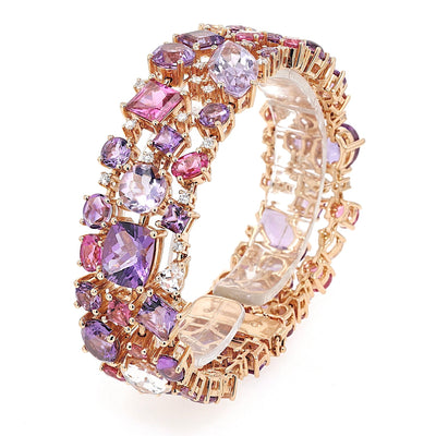 Bracelet by Buchwald in 750 rose gold with amethysts, tourmalines, sapphires, rubellites, morganites and brilliants, standing twisted