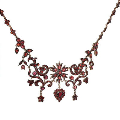 Antique and unusual garnet necklace made of tombac, gold-plated, hanging, turned to the right