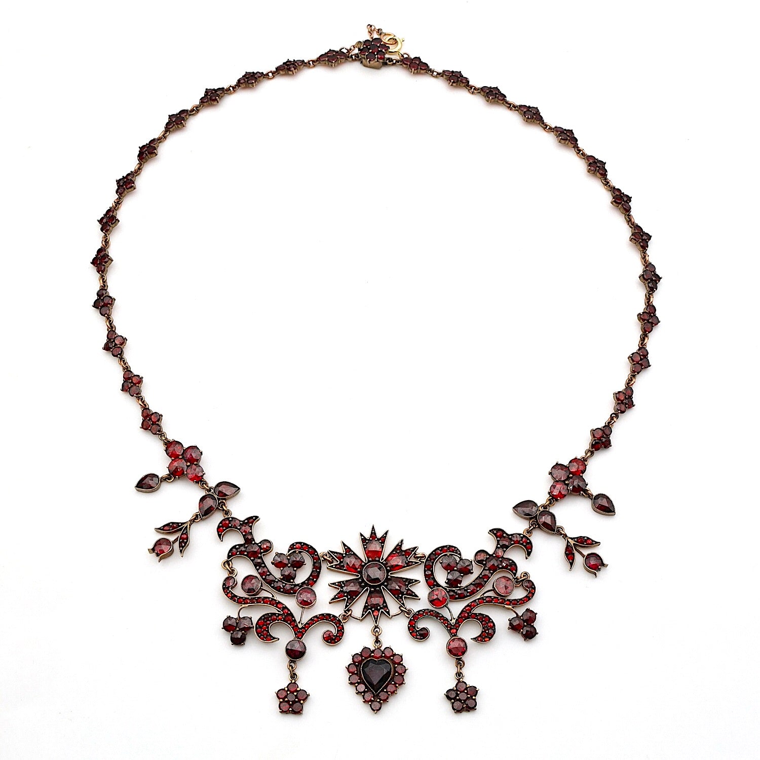 Antique and unusual garnet necklace in tombac, gold-plated, horizontal top view