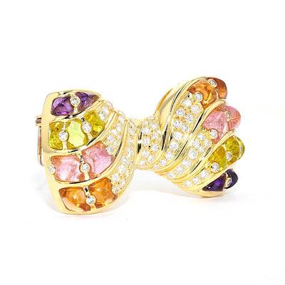 Brooch in 750 yellow gold with brilliants, amethysts, citrines, tourmalines and glass, standing turned to the right