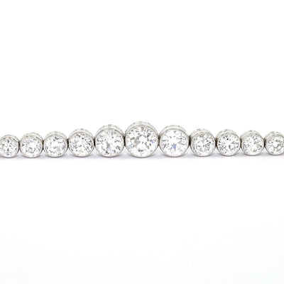 Art Deco tennis bracelet in platinum with a total of approx. 5.1 ct diamonds, close-up lying frontally