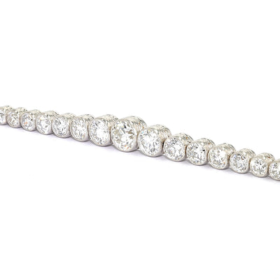 Art Deco tennis bracelet in platinum with a total of approx. 5.1 ct of diamonds, close-up lying left turned