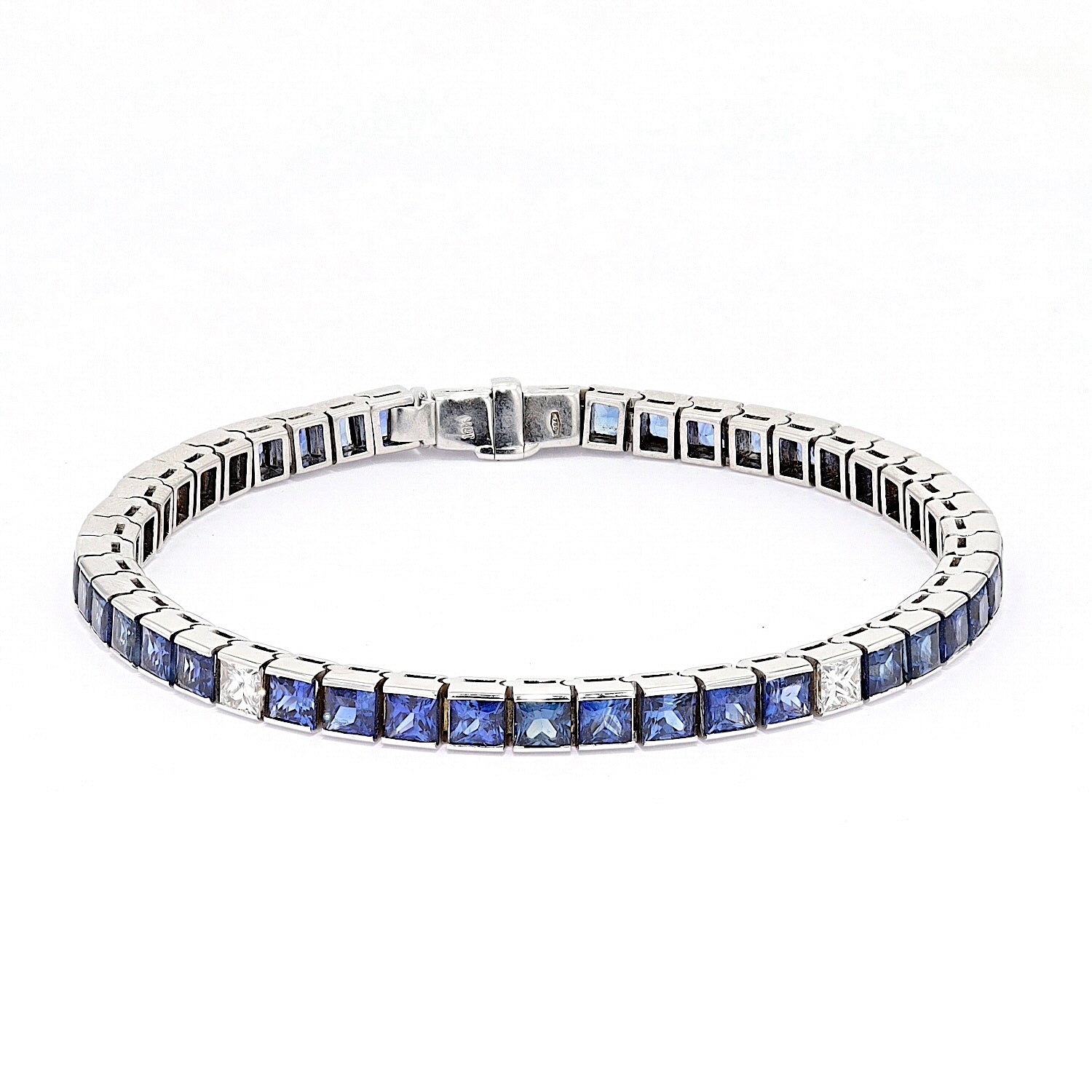 Bracelet in 750 white gold with a total of approx. 12.6 ct sapphires and approx. 1.25 ct diamonds, lying frontally