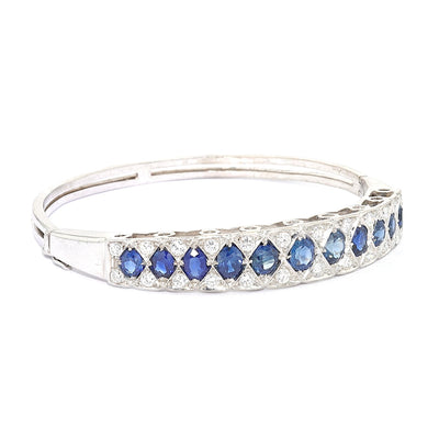 Vintage bangle in 585 white gold with blue sapphires and brilliants, turned horizontally to the right