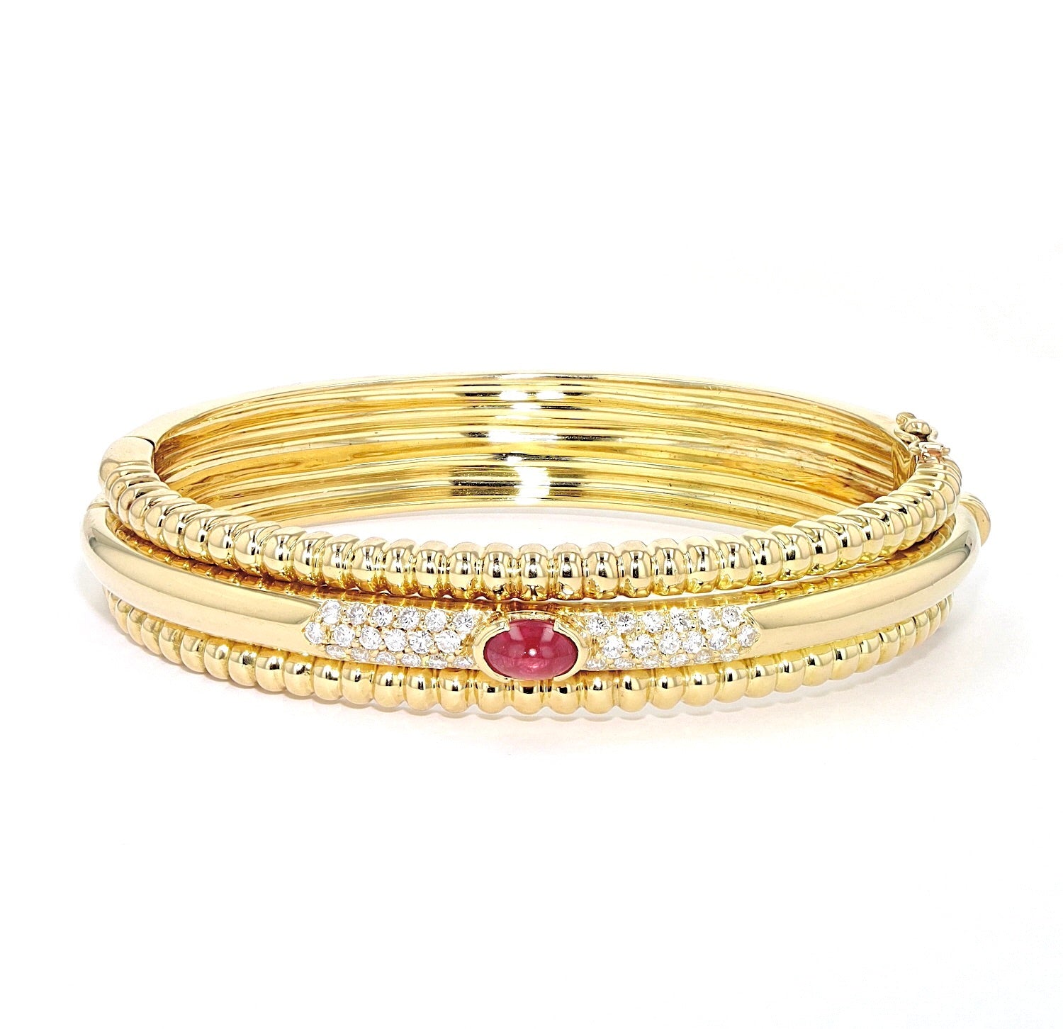 Exclusive Piaget bangle in 750 yellow gold with a Ruby and brilliants, lying frontally