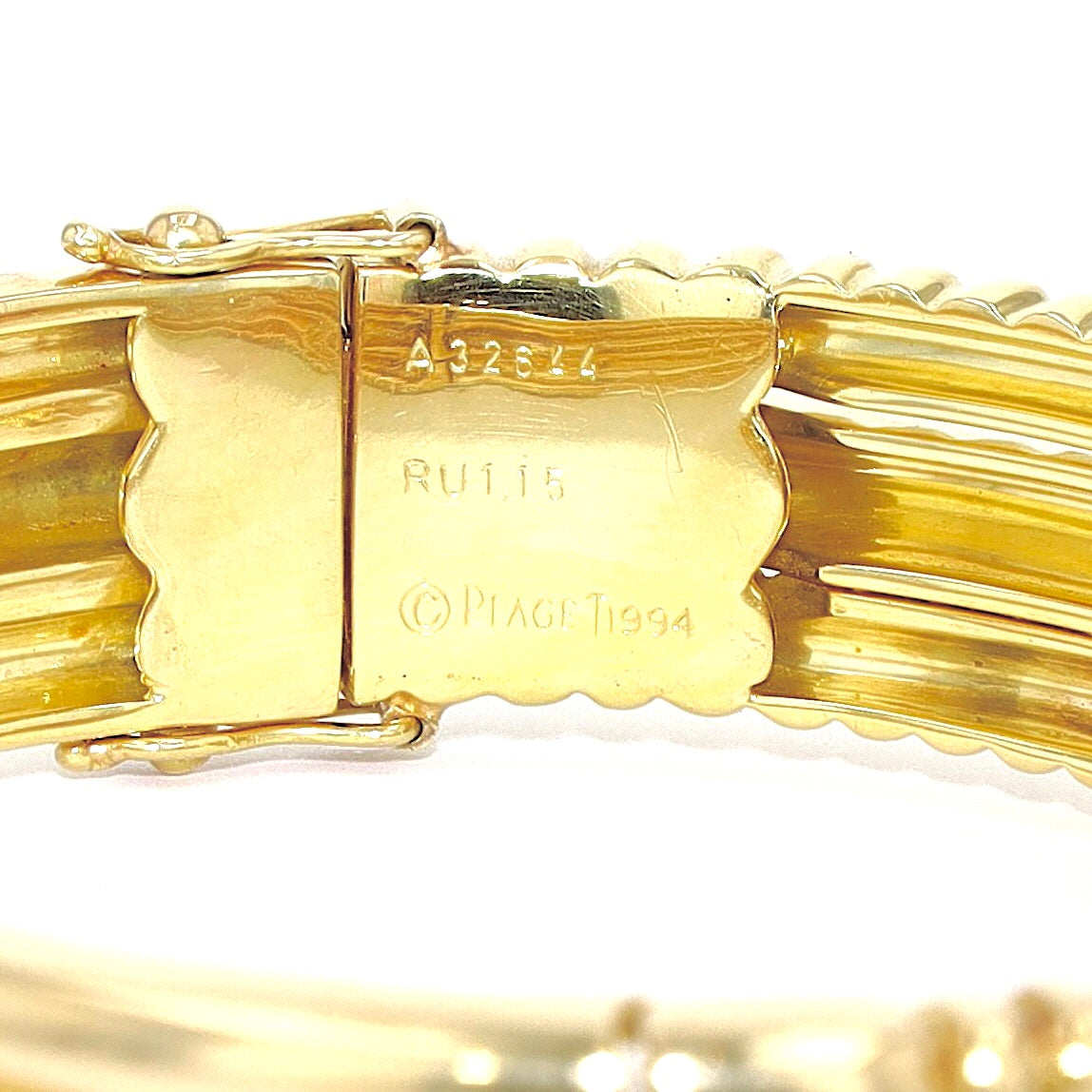 Exclusive Piaget bangle in 750 yellow gold with a Ruby and brilliants, engraving