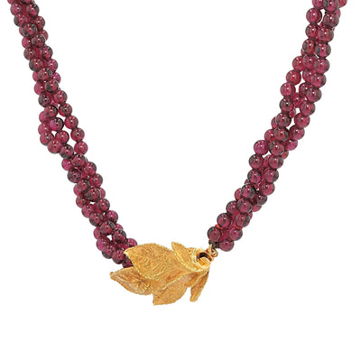 Ehinger Schwarz necklace made of rhodolite spheres and a lock in 750 yellow gold, hanging left turned