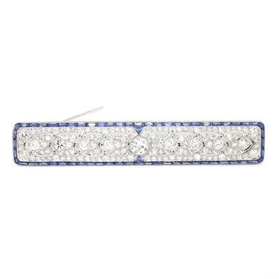 Large Art Déco brooch in 900 platinum with a total of approx. 2.7 ct diamonds and 62 sapphires, lying frontally