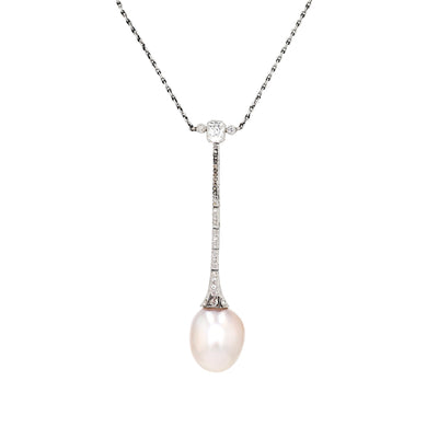 Art Deco necklace in platinum with a large natural pearl and diamonds, close-up hanging turned left