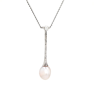 Art Deco necklace in platinum with a large natural pearl and diamonds, hanging turned to the right