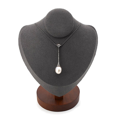 Art Deco necklace in platinum with a large natural pearl and diamonds at the bust