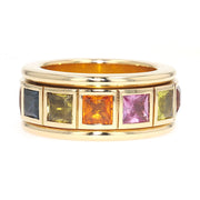 Play ring in 750 yellow gold with colorful sapphires, lying frontally