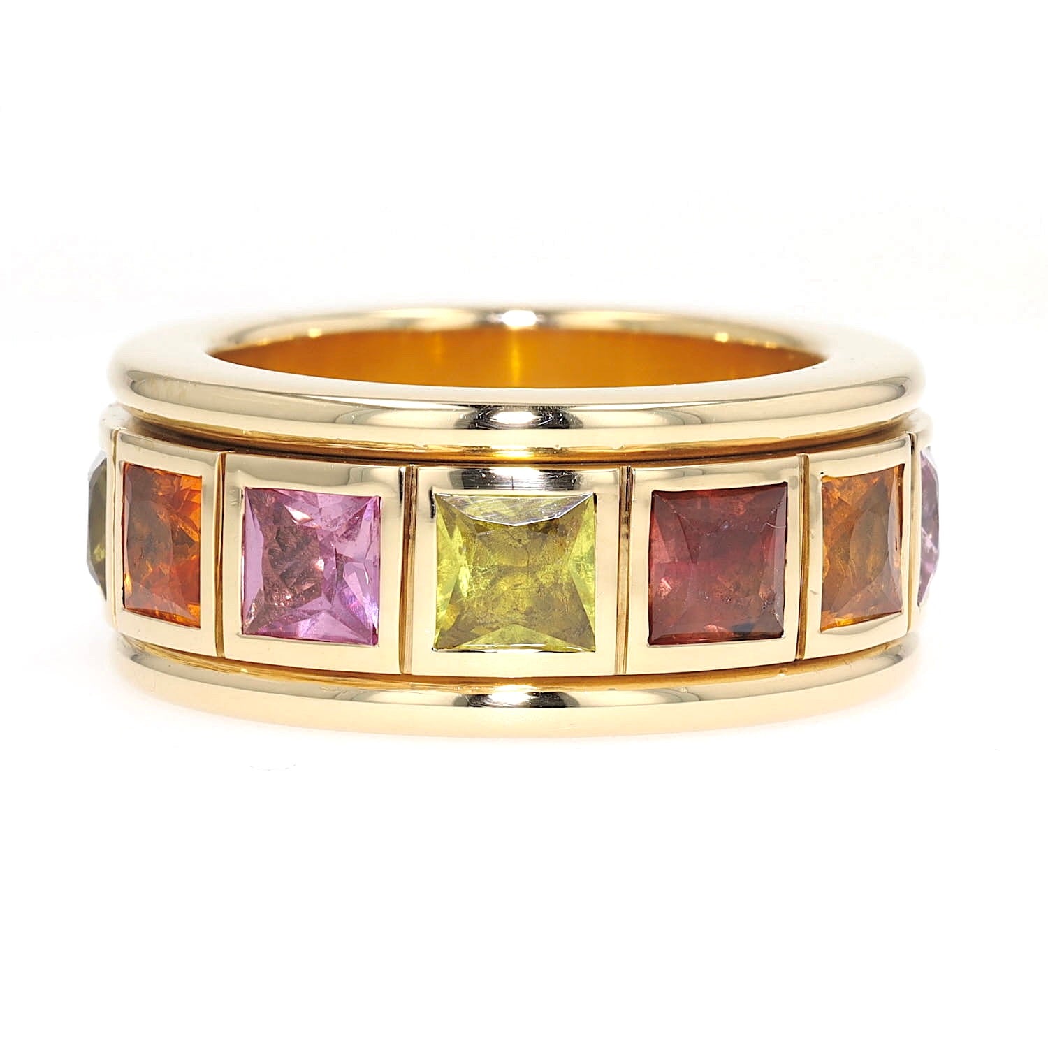 Play ring in 750 yellow gold with colorful sapphires, turned horizontally to the left