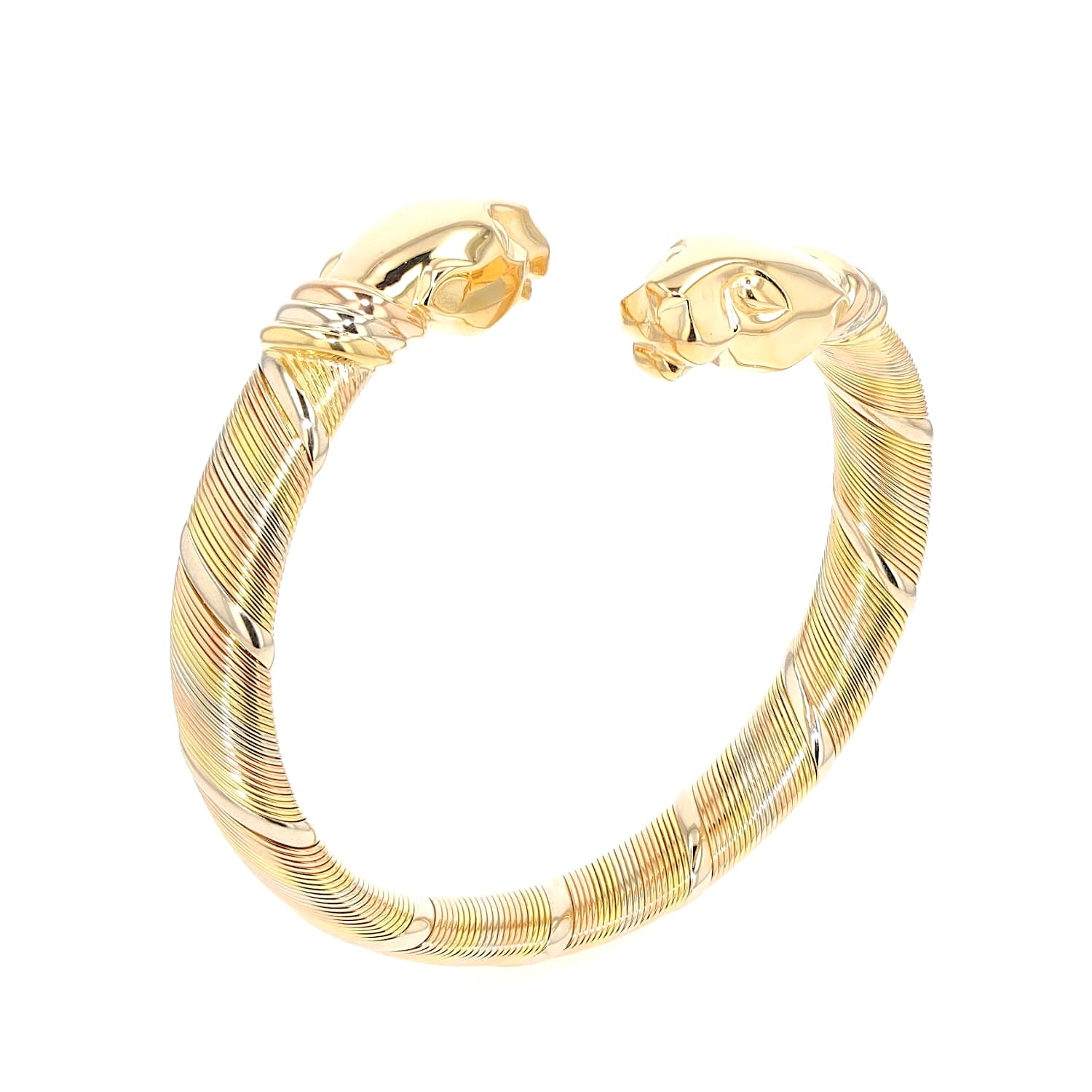 Vintage bangle by Cartier ,Cougar Panthère in 750 tricolor gold, standing right turned