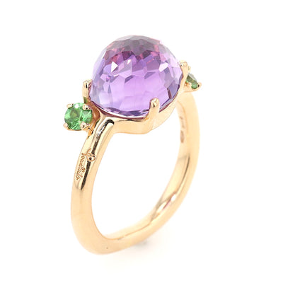 Pomellato ring in 750 rose gold with an amethyst and tsavorite, standing top view