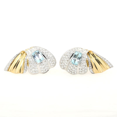 Exclusive pair of ear clips in 750 white and yellow gold with a total of approx. 4 ct brilliants and 2 aquamarines, lying frontally