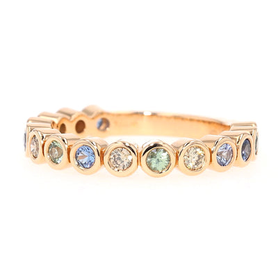 Bron Confetti ring in 750 rose gold with colorful sapphires and brilliants, turned horizontally to the left